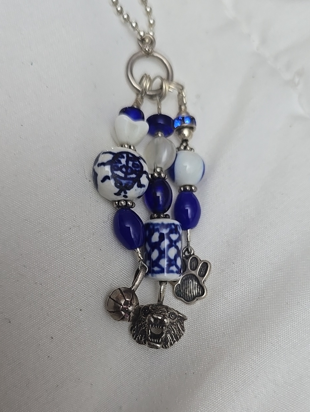 Wildcats Necklace with Dangling Charms.